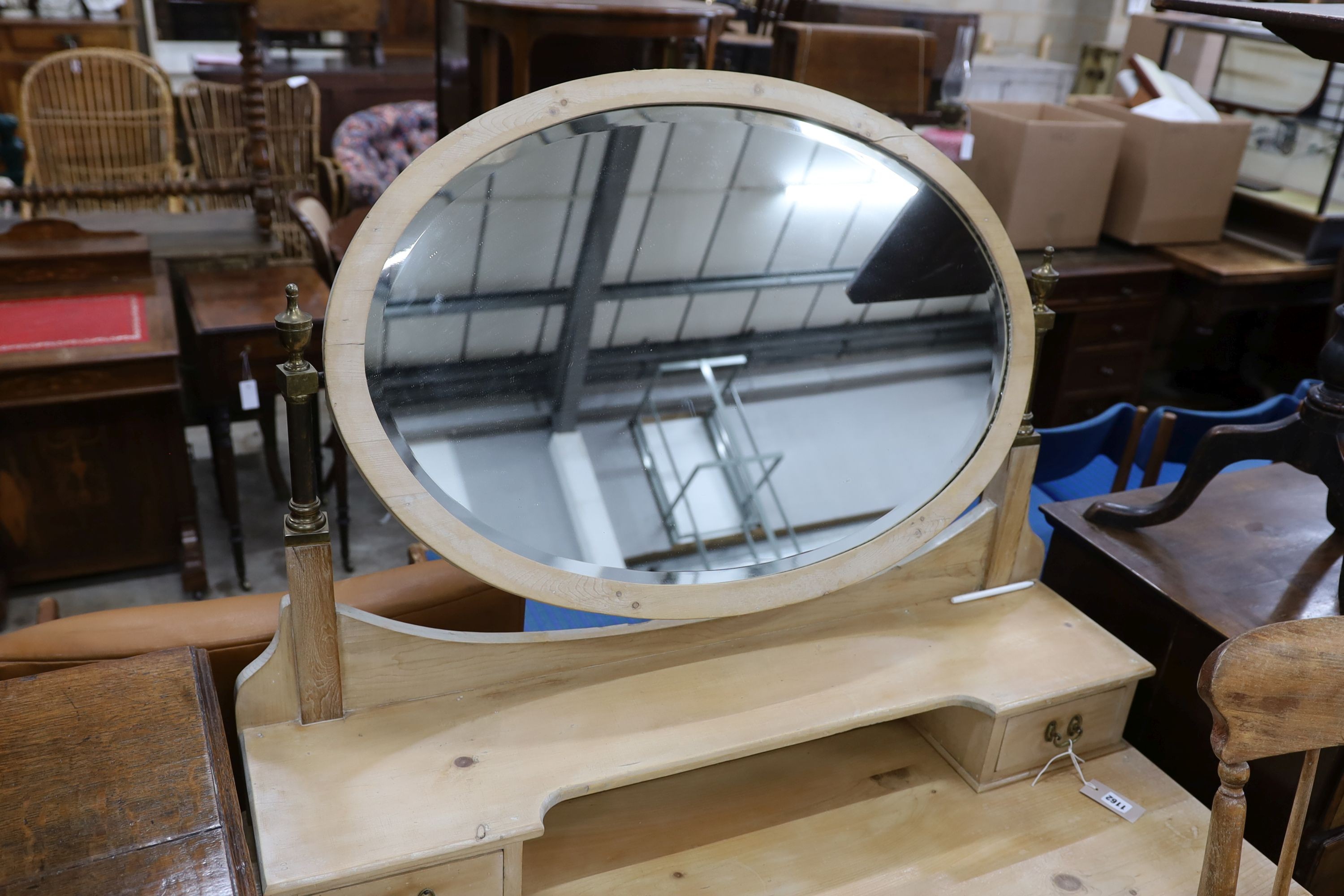 An Edwardian pine dressing table, width 106cm, depth 51cm, height 154cm together with a Victorian elm and beech Windsor armchair